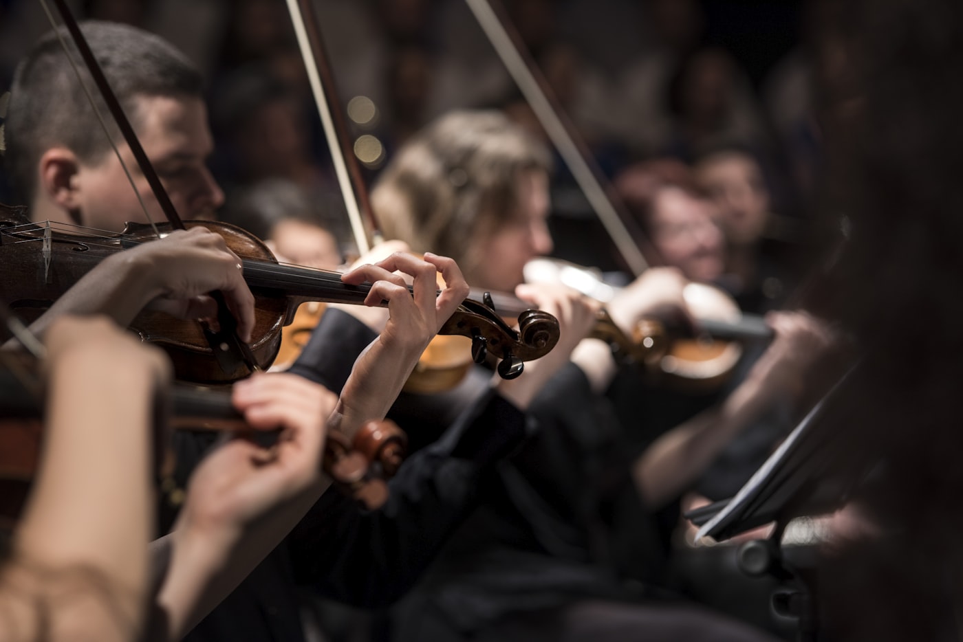 A conductor leading an orchestra